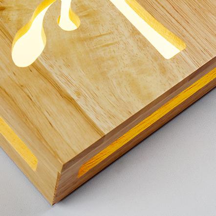 Skorter | NatureShine - Modern LED wall lamp made of solid wood with playful design