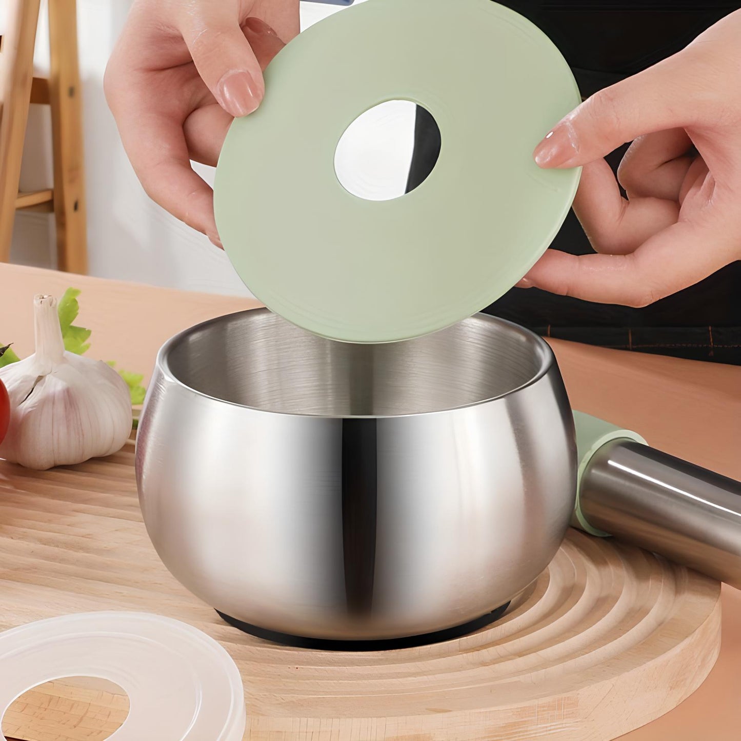 Skorter and a stainless steel mortar with lid