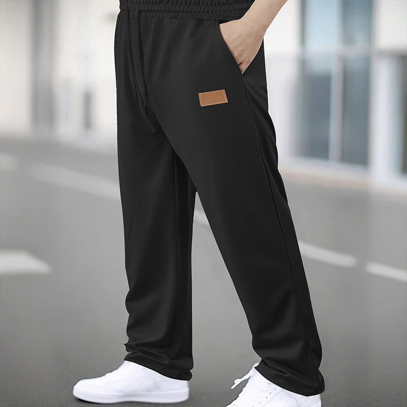 Men's Sporty Jogging Pants with Elastic Waistband and Practical Pockets Skorter