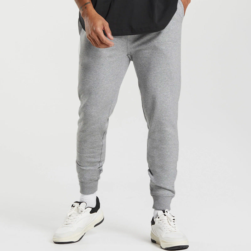 Men's sports sweatpants with striped elastic cuffs and practical side pockets Skorter