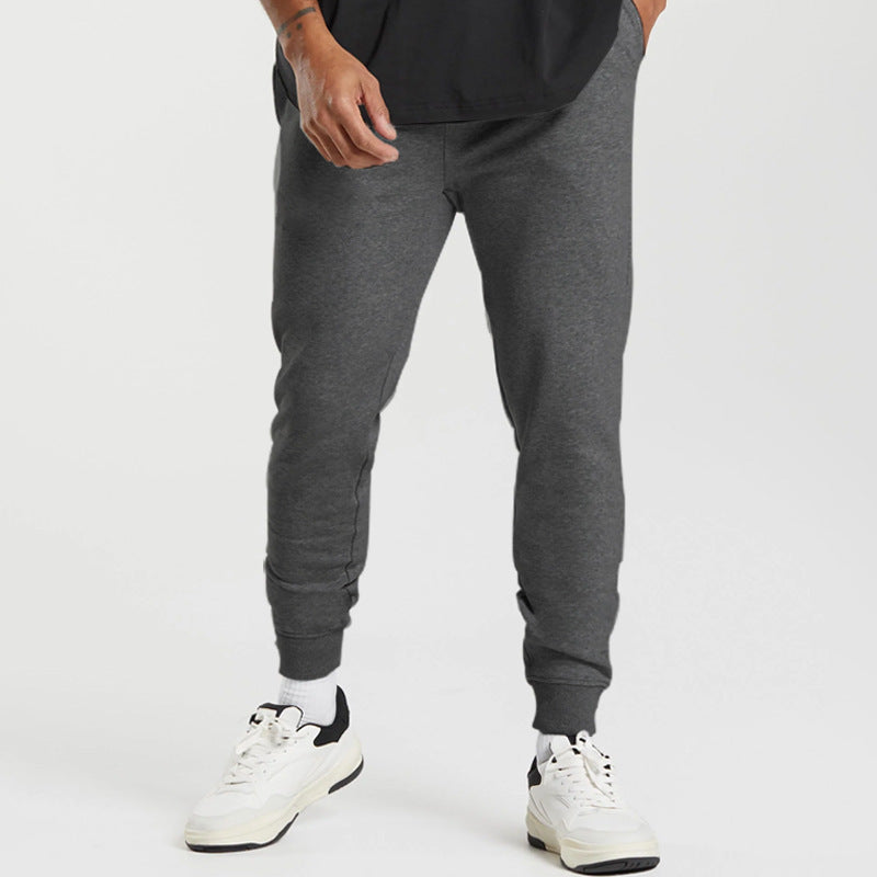 Men's sports sweatpants with striped elastic cuffs and practical side pockets Skorter