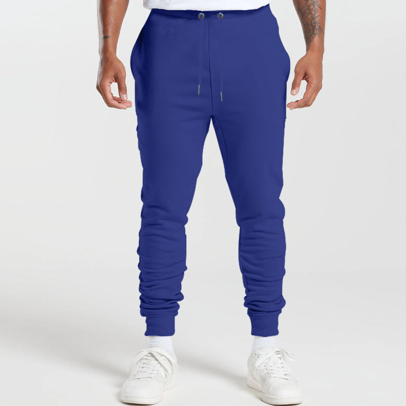 Men's sports sweatpants with striped elastic cuffs and practical side pockets Skorter