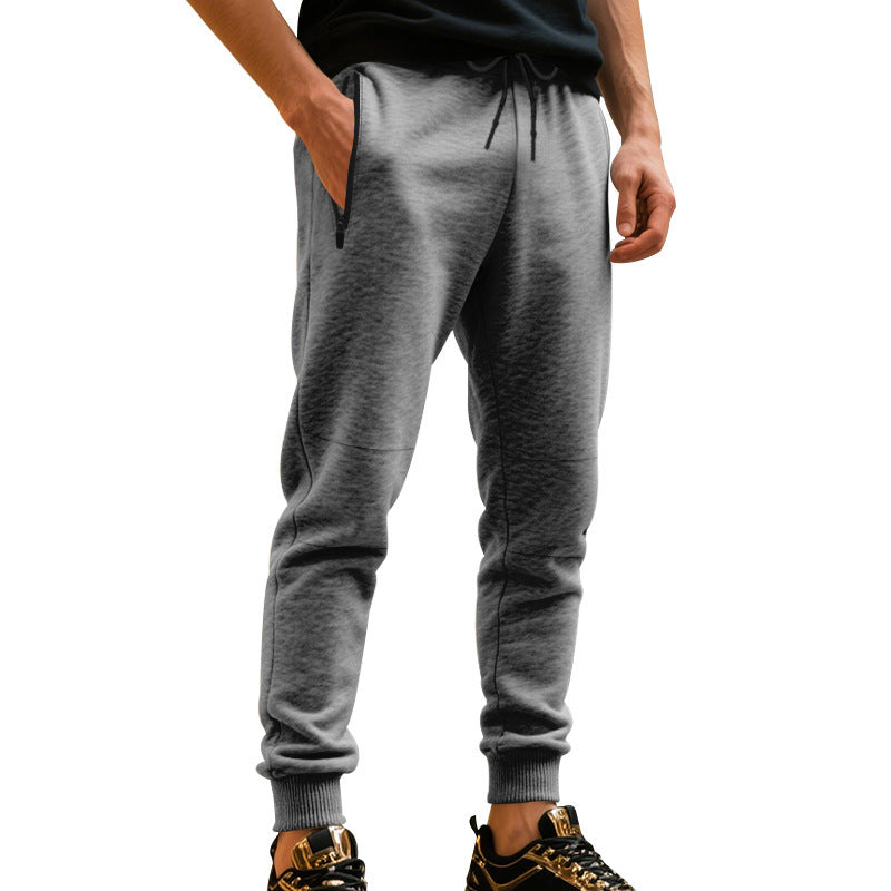 Men's sporty jogging pants with elastic waistband and practical pockets Skorter