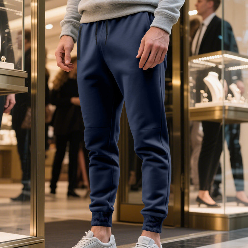 Men's sporty jogging pants with elastic waistband and practical pockets Skorter