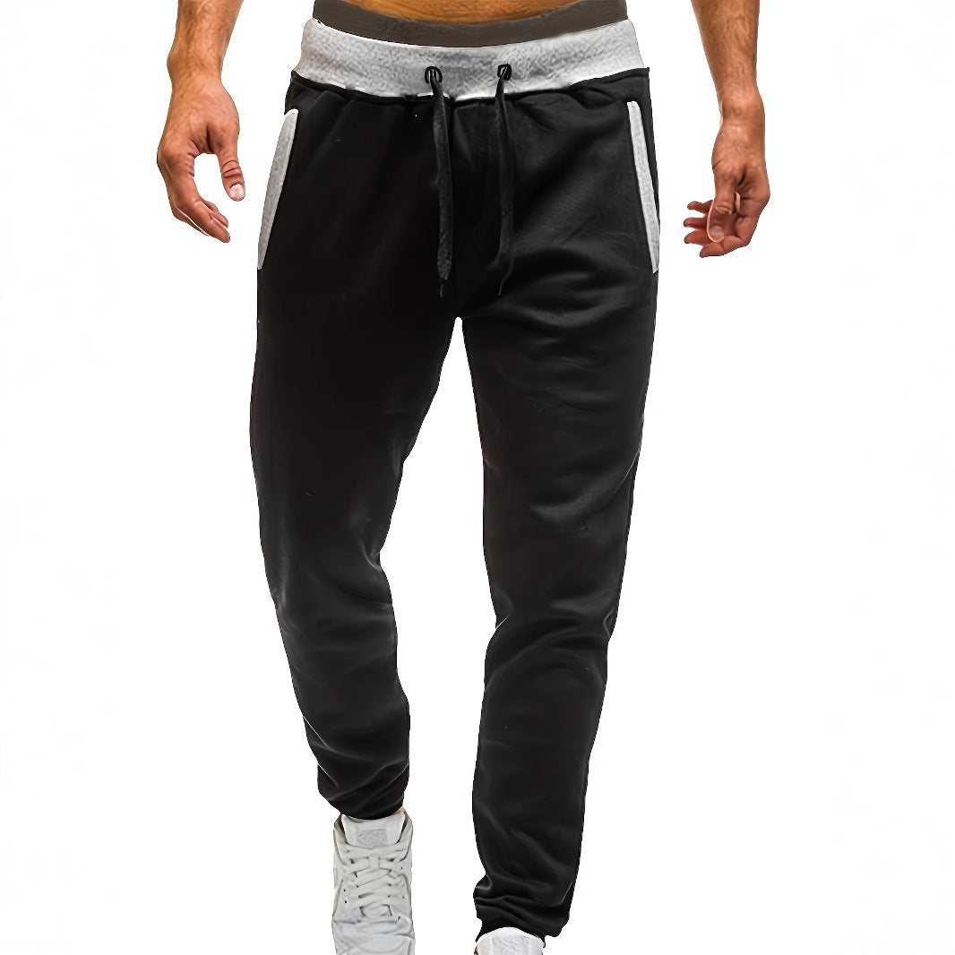 Men's sporty jogging pants with incorporated side pockets and adjustable drawstring Skorter