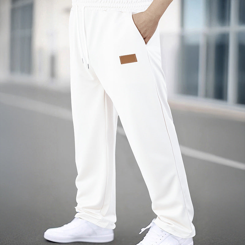 Men's Sporty Jogging Pants with Elastic Waistband and Practical Pockets Skorter
