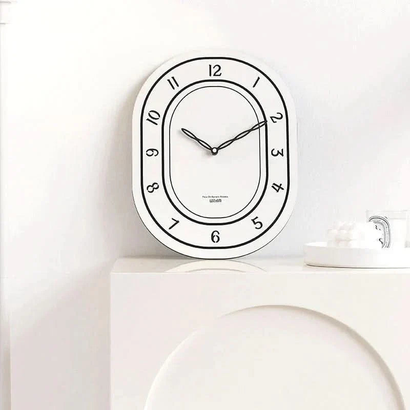 Skorter | Silent Oval Wall Clock with Roman Numerals Design