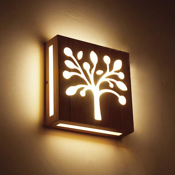 Skorter | NatureShine - Modern LED wall lamp made of solid wood with playful design