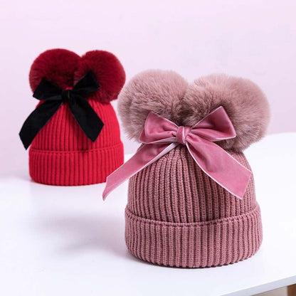 Skorter | Baby hat with double ball bow