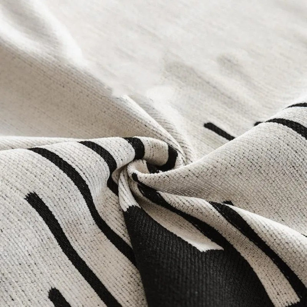 Skorter | Elegant Black and White Sofa Cover Protector