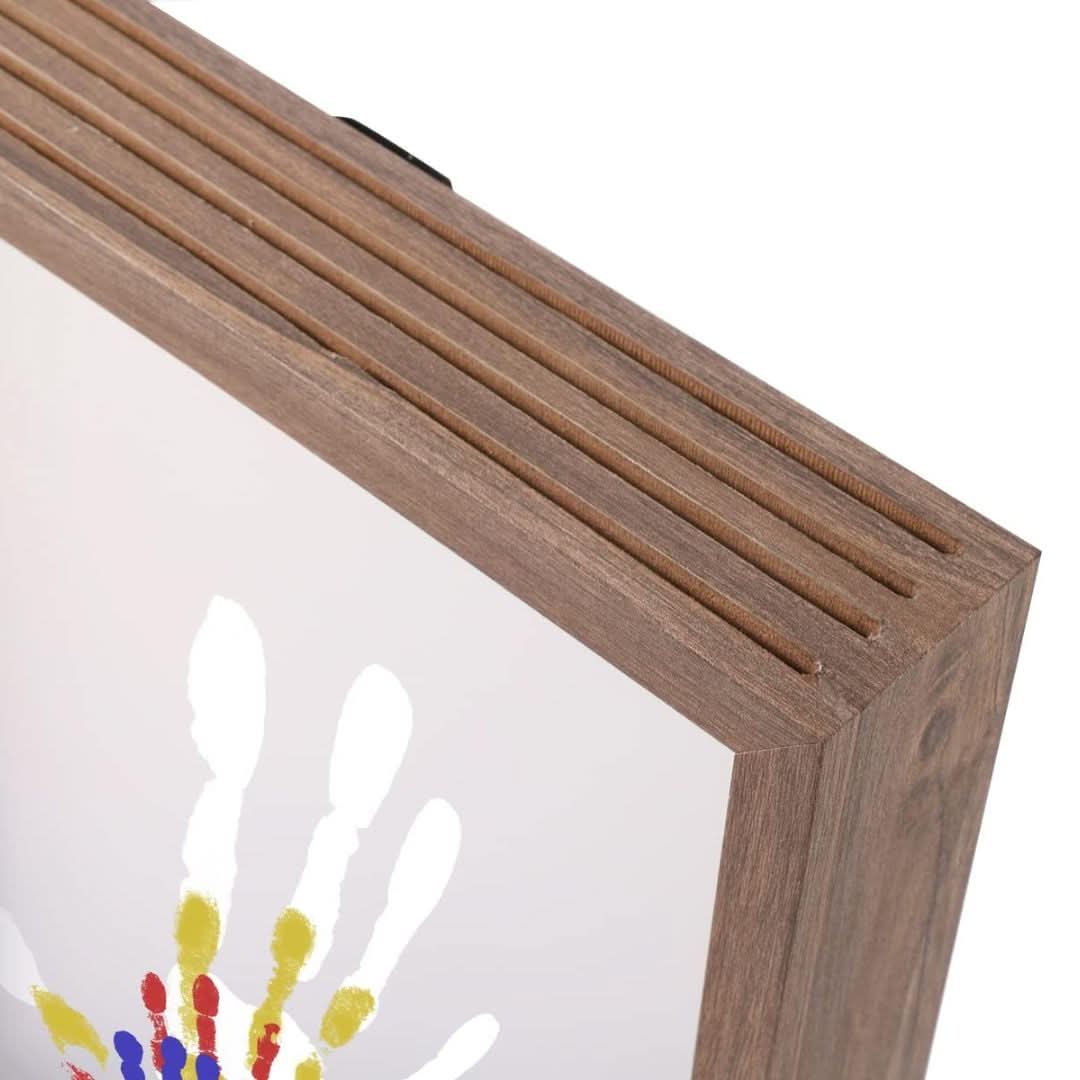 Skorter | Baby memory frame made of wood with clay for hand & foot prints