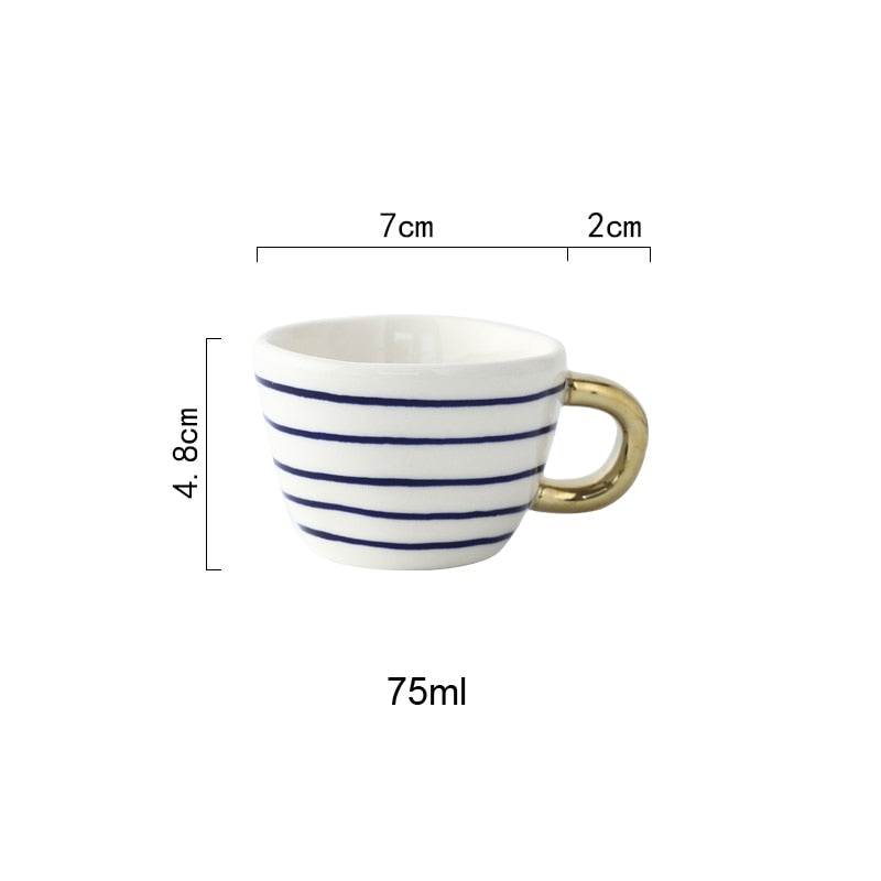 Skorter | Cup with abstract geometric pattern and gold handle