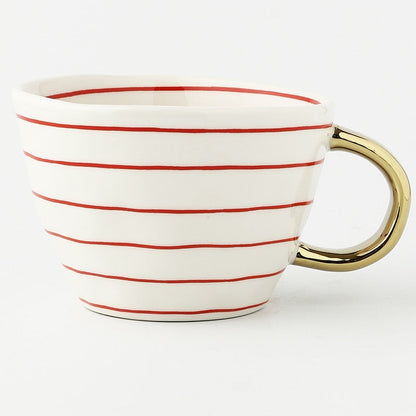 Skorter | Cup with abstract geometric pattern and gold handle