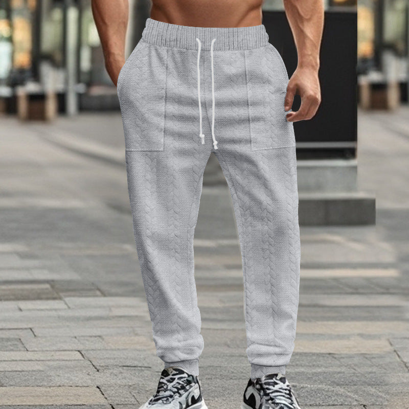 Men's sporty joggers with textured design and elastic waistband Skorter