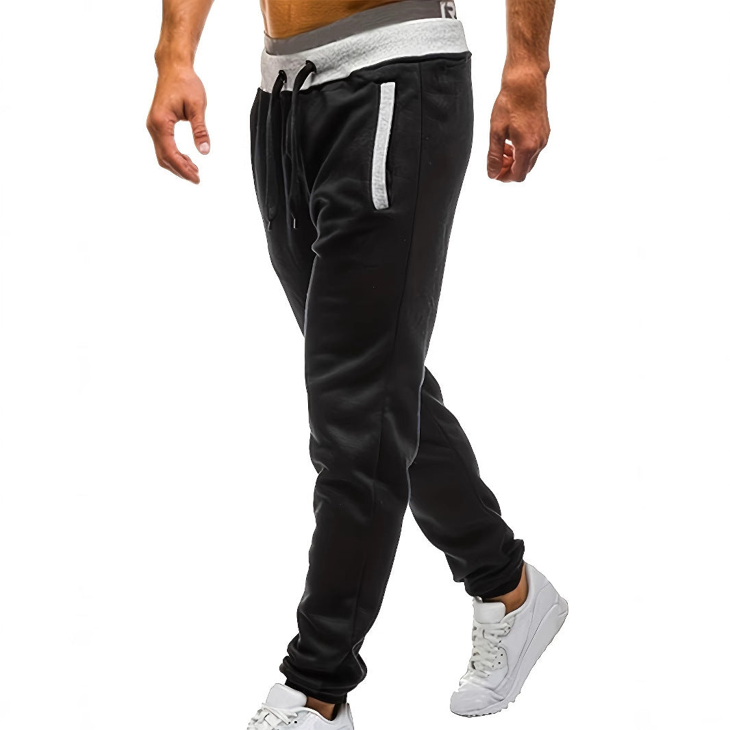 Men's sporty jogging pants with incorporated side pockets and adjustable drawstring Skorter
