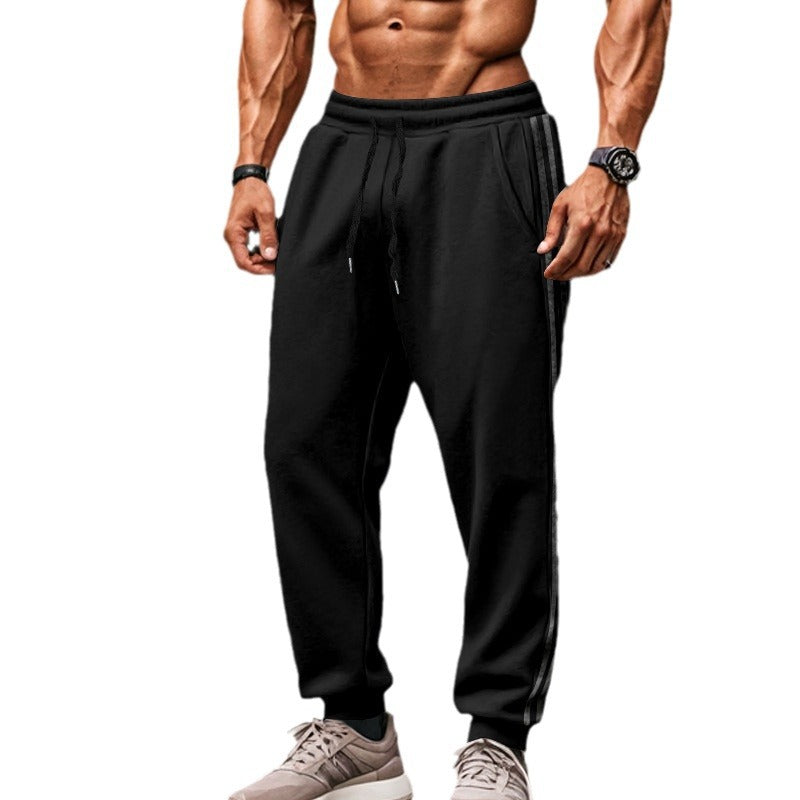 Men's sporty training pants with side stripes Skorter
