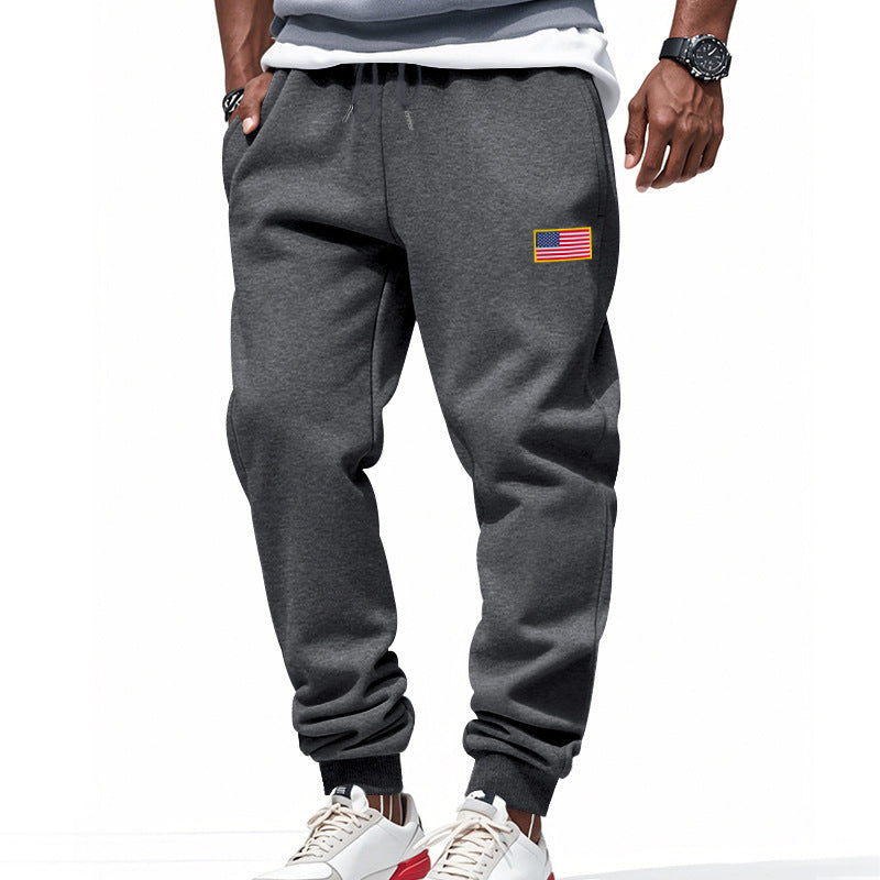 Men's sporty sweatpants with elastic waistband and practical side pockets Skorter
