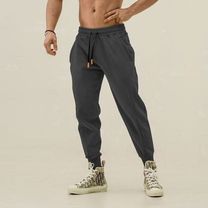 Men's sporty sweatpants with elastic waistband and side zip pockets Skorter