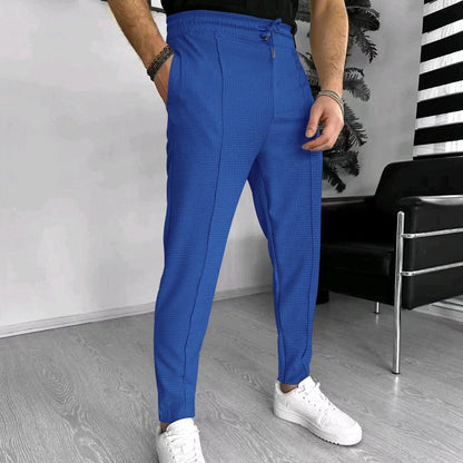 Men's stylish high-waisted pants with elastic drawstring and textured design Skorter