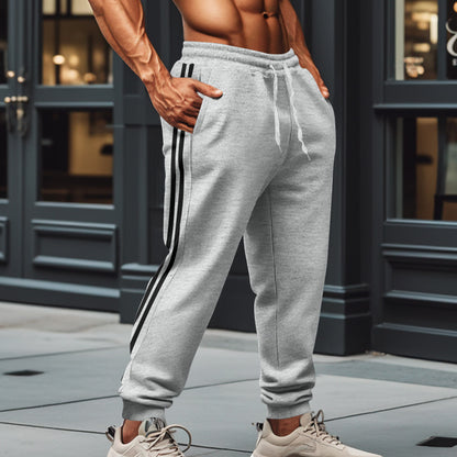 Men's sporty training pants with side stripes Skorter