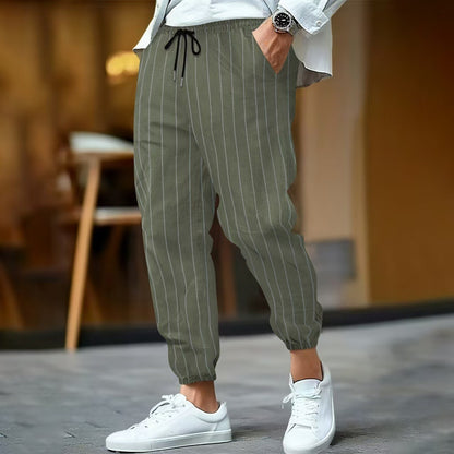Men's elegant leisure pants with elastic waistband and side stripes Skorter