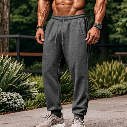 Men's sporty training pants with side stripes Skorter