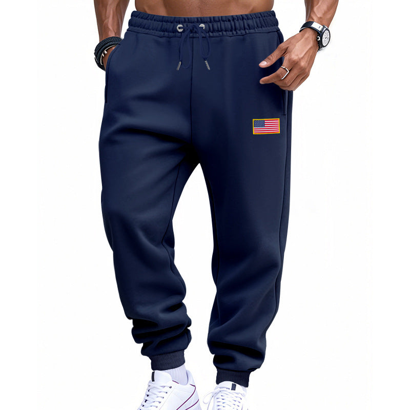 Men's sporty sweatpants with elastic waistband and practical side pockets Skorter