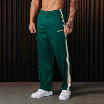 Men's sporty jogging pants with side contrast stripes and elastic waistband Skorter