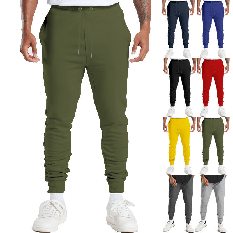 Men's sports sweatpants with striped elastic cuffs and practical side pockets Skorter