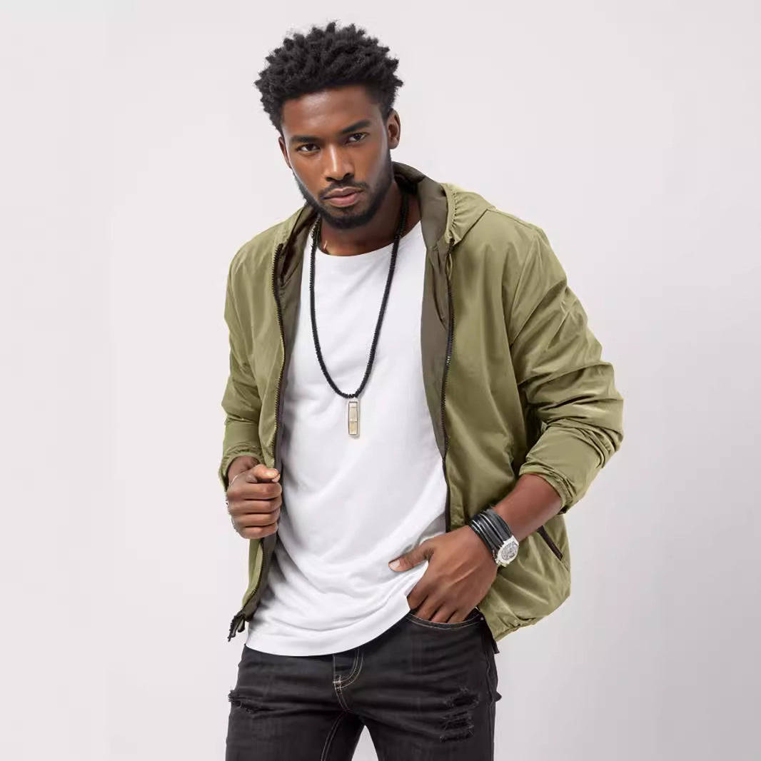 Men's sporty transition jacket with functional hood collar and elastic cuffs Skorter