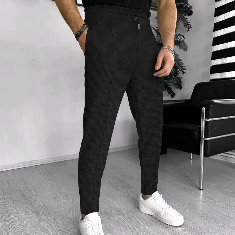 Men's stylish high-waisted pants with elastic drawstring and textured design Skorter
