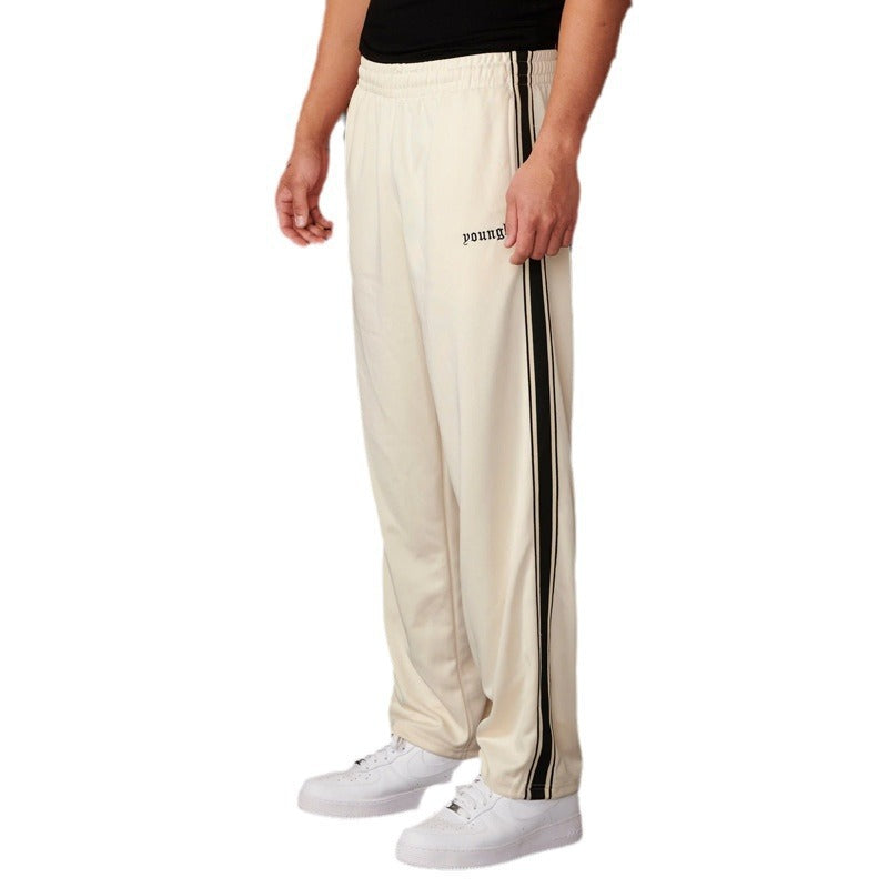 Men's sporty jogging pants with side contrast stripes and elastic waistband Skorter