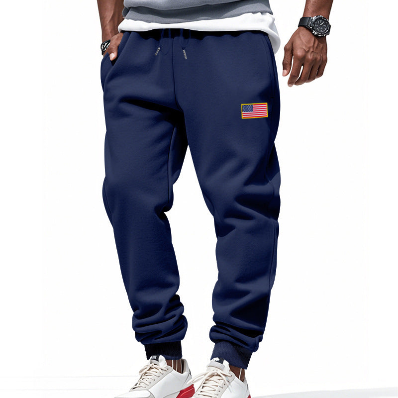 Men's sporty sweatpants with elastic waistband and practical side pockets Skorter