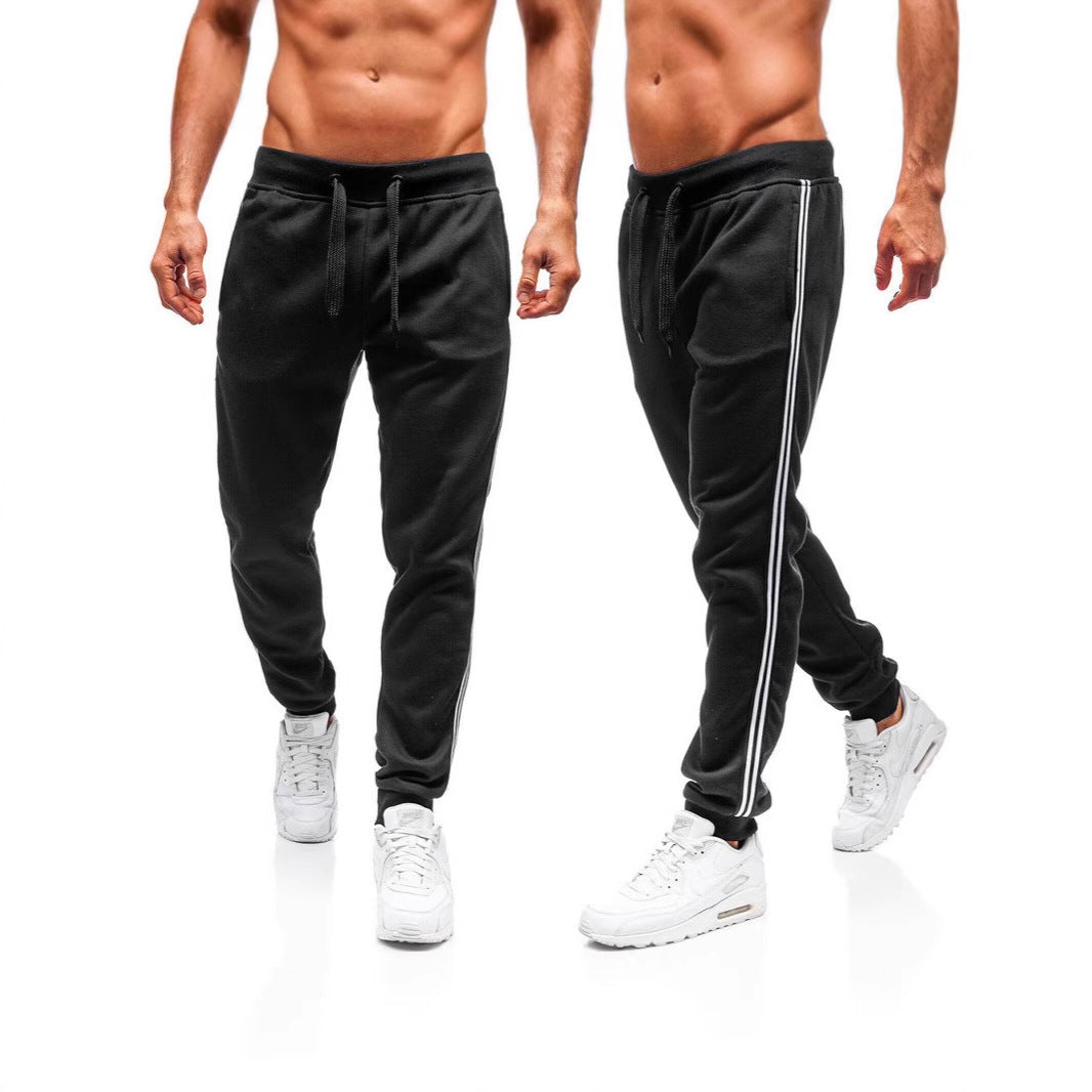 Men's sporty jogging pants with side contrast stripes Skorter