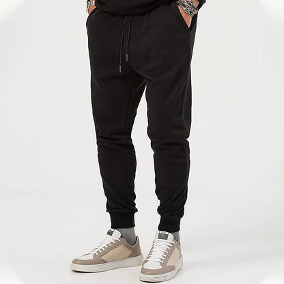 Men's sporty jogging pants with adjustable drawstring and elastic cuffs Skorter