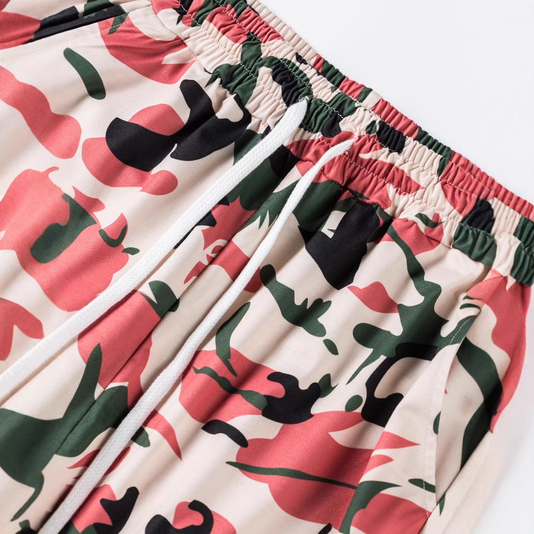 Herrjoggingbyxor i kamouflage med resår i midjan och sidofickor, skorter