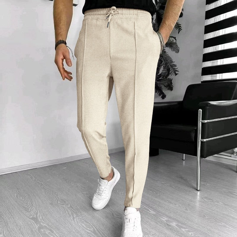 Men's stylish high-waisted pants with elastic drawstring and textured design Skorter