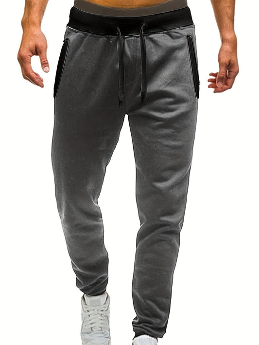 Men's sporty sweatpants with elastic waistband and side pockets Skorter