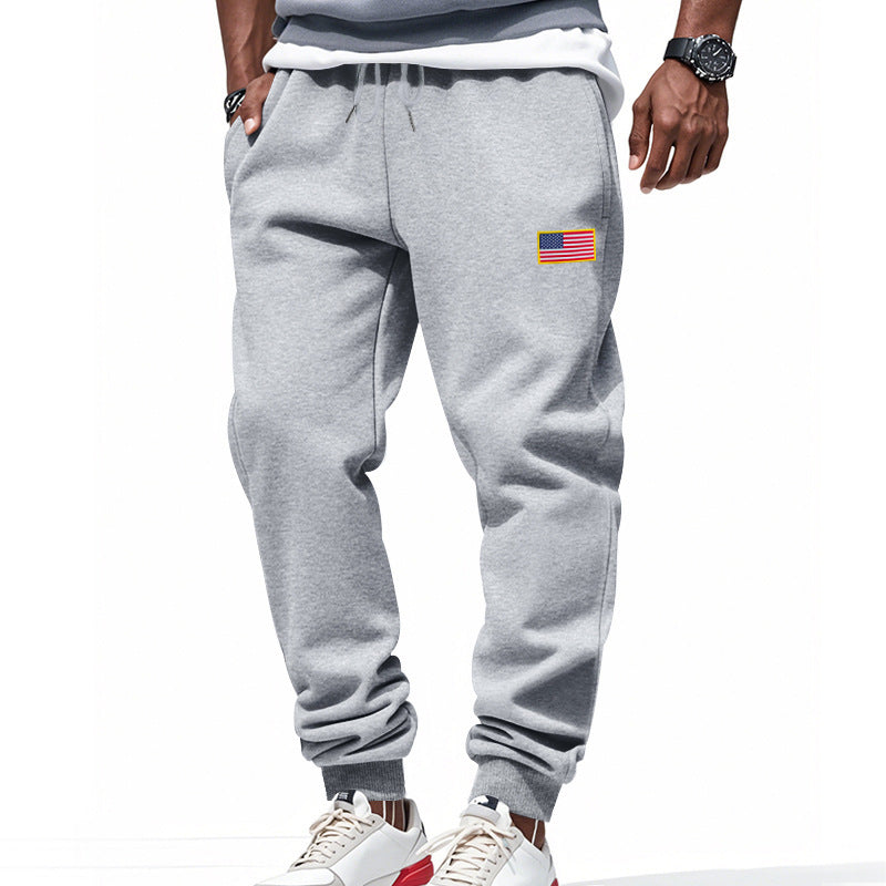 Men's sporty sweatpants with elastic waistband and practical side pockets Skorter