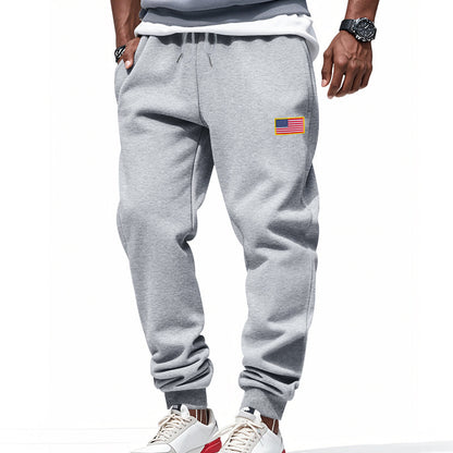 Men's sporty sweatpants with elastic waistband and practical side pockets Skorter