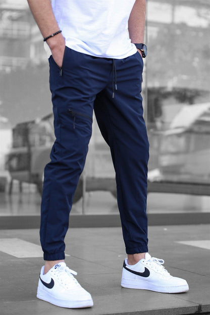Men's sporty suit pants with elastic waistband and side zip pockets Skorter