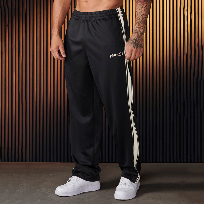 Men's sporty jogging pants with side contrast stripes and elastic waistband Skorter