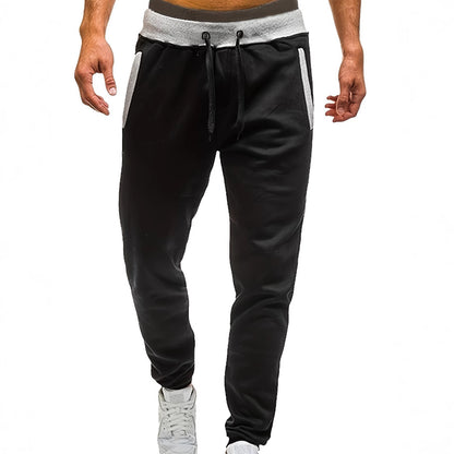 Men's sporty jogging pants with incorporated side pockets and adjustable drawstring Skorter