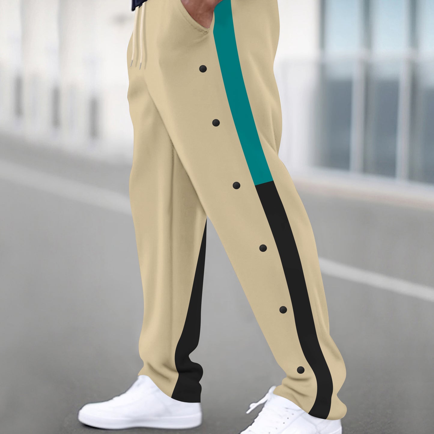 Men's sporty training pants with side snap buttons and elastic waistband Skorter