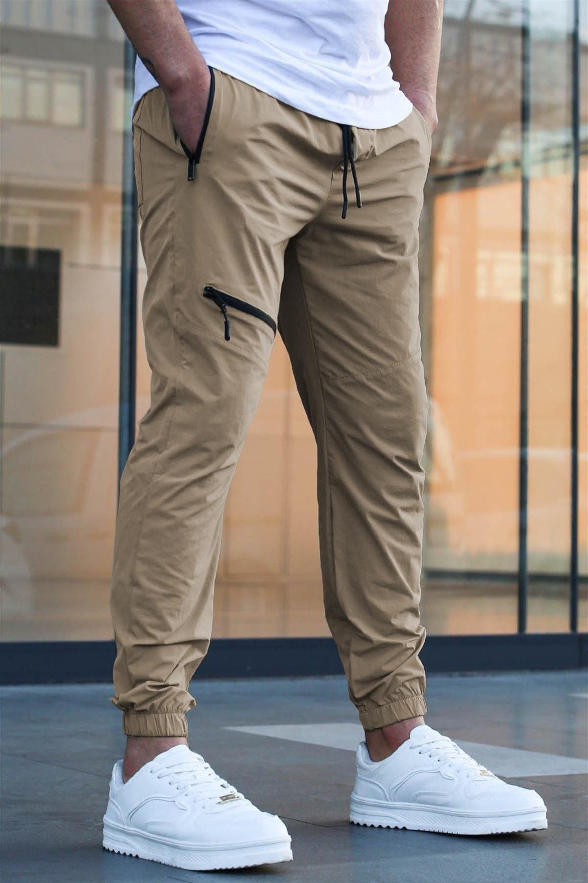 Men's sporty suit pants with elastic waistband and side zip pockets Skorter