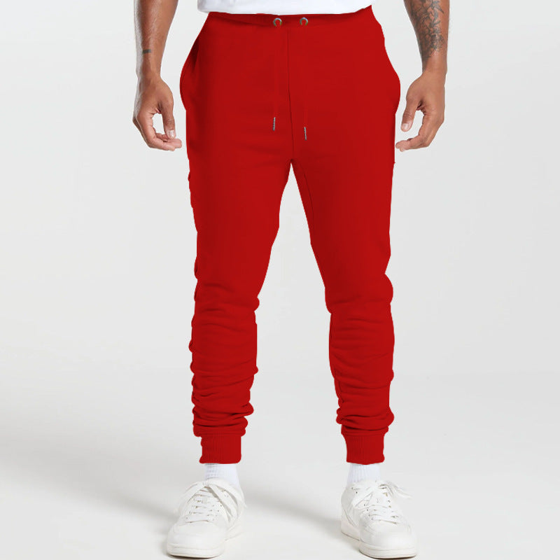 Men's sports sweatpants with striped elastic cuffs and practical side pockets Skorter