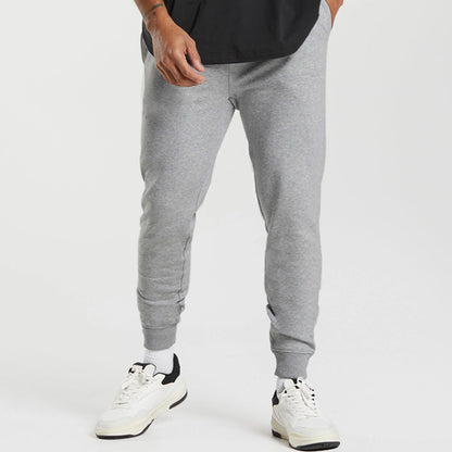 Men's sports sweatpants with striped elastic cuffs and practical side pockets Skorter