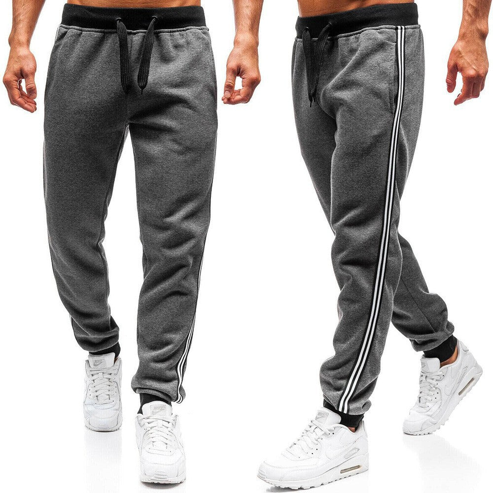 Men's sporty jogging pants with side contrast stripes Skorter