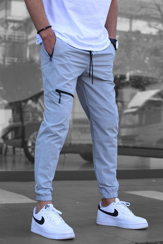 Men's sporty suit pants with elastic waistband and side zip pockets Skorter