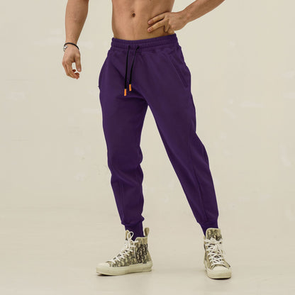 Men's sporty sweatpants with elastic waistband and side zip pockets Skorter
